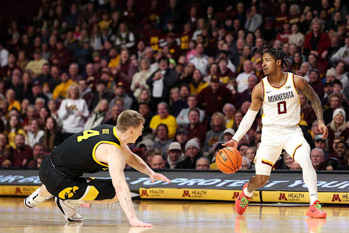 Elijah Hawkins dribbles